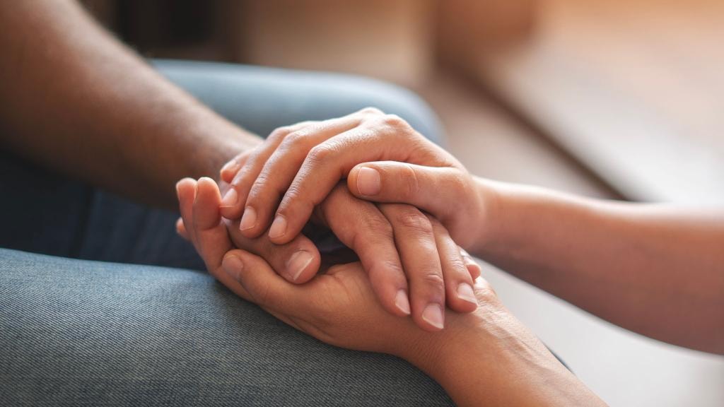 Hands joined in community support